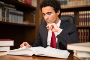 Lawyer studying legal books