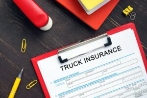 Financial concept: Truck insurance application form with key phrases on business paper.