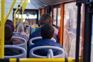 People sitting in public transport, commuting to their destinations with a sense of routine and community.