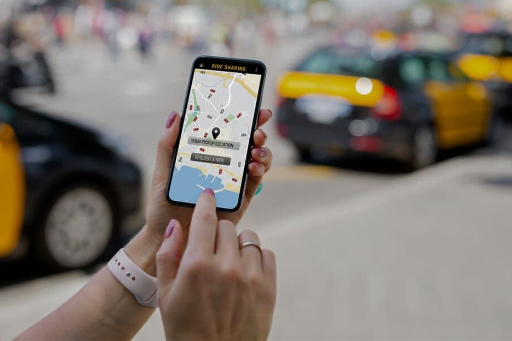 A lady using rideshare application in Cape Girardeau