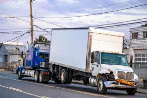 Big rig semi truck tractor towing broken after accident