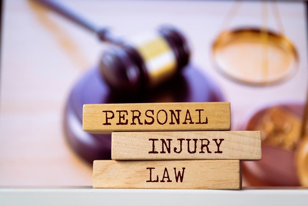 "Wooden blocks arranged with the words 'Personal Injury Law' on them, representing a legal concept related to personal injury cases."