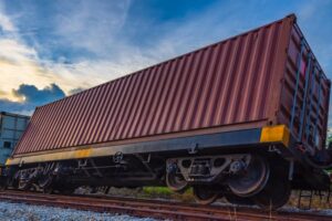 Container freight train accident with derailed car