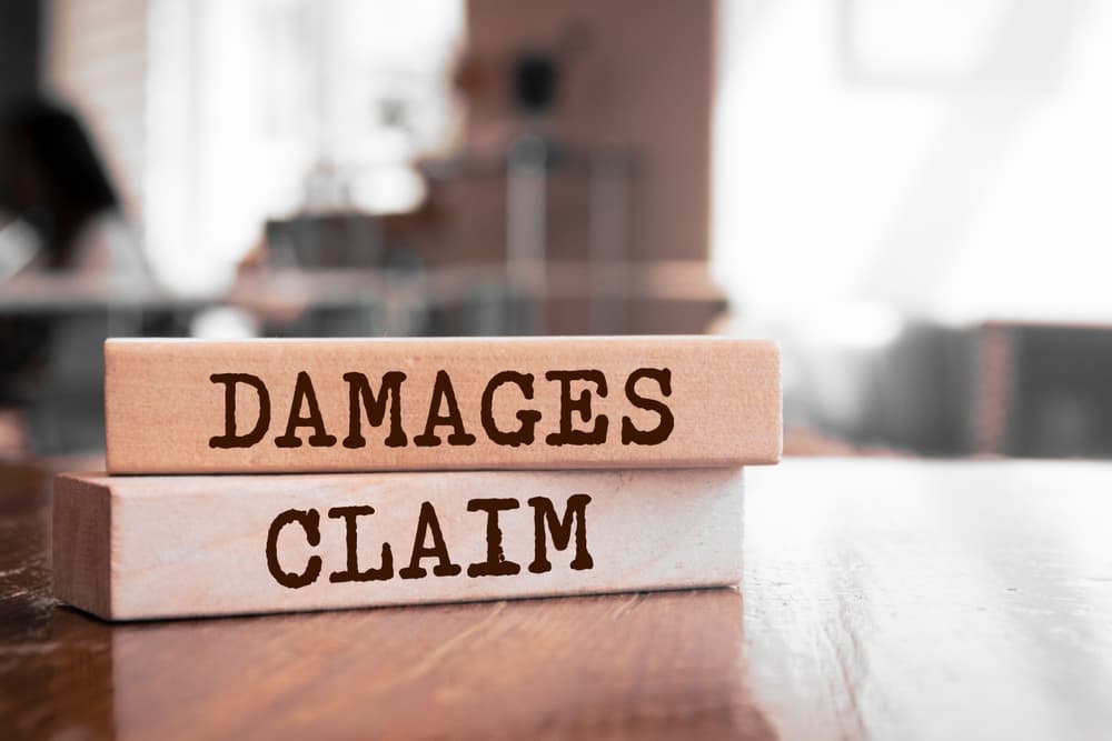 Damages & Claim Written Wooden Blocks