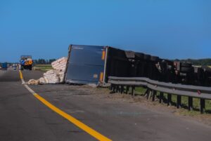 Accident on the road overturned truck semi-trailer with cargo