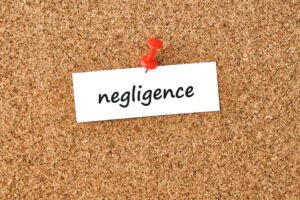 Negligence word written on piece of a paper